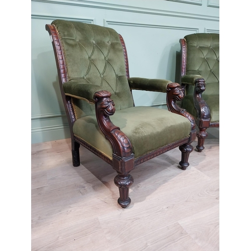 149 - Pair of Irish mahogany upholstered armchairs decorated with lion's masks on turned legs. {97 cm H x ... 