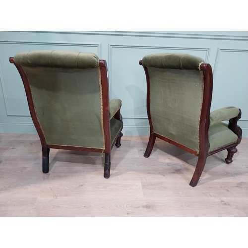 149 - Pair of Irish mahogany upholstered armchairs decorated with lion's masks on turned legs. {97 cm H x ... 