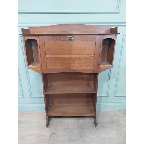 166 - Edwardian oak fold down desk with open bookshelf. {124 cm H x 98 cm W x 24 cm D}.