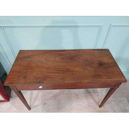21 - 19th C. inlaid mahogany side table on four tapered legs. {75 cm H x 119 cm W x 53 cm D}.