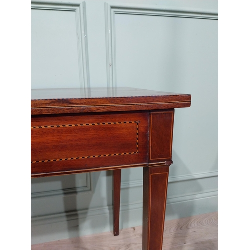 21 - 19th C. inlaid mahogany side table on four tapered legs. {75 cm H x 119 cm W x 53 cm D}.