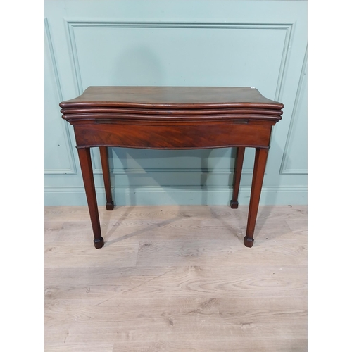 389 - Georgian mahogany triple fold games table on square legs. {77 cm H x 90 cm W x 41 cm D}