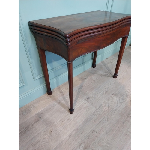 389 - Georgian mahogany triple fold games table on square legs. {77 cm H x 90 cm W x 41 cm D}