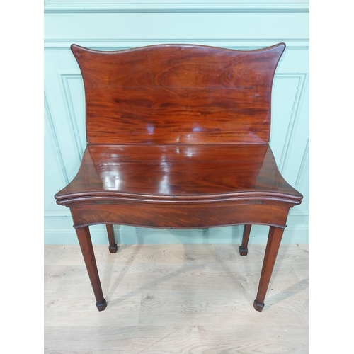 389 - Georgian mahogany triple fold games table on square legs. {77 cm H x 90 cm W x 41 cm D}