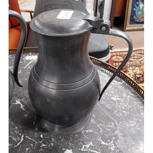 432 - 19th C. pewter flagon, tea pot and copper tankard. {22 cm H x 14 cm Dia, 21 cm H x 12 cm Dia and 17 ... 