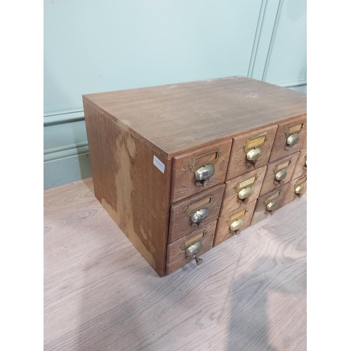 48 - 1950's oak bank of twelve drawers with brass handles.  {35 cm H x 68 cm W x 42 cm D}.