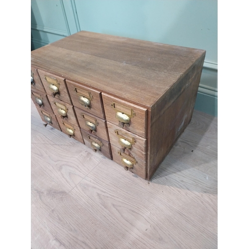 48 - 1950's oak bank of twelve drawers with brass handles.  {35 cm H x 68 cm W x 42 cm D}.
