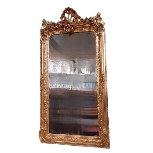 57 - Decorative French gilt wall mirror. {158 cm H x 83 cm W}.