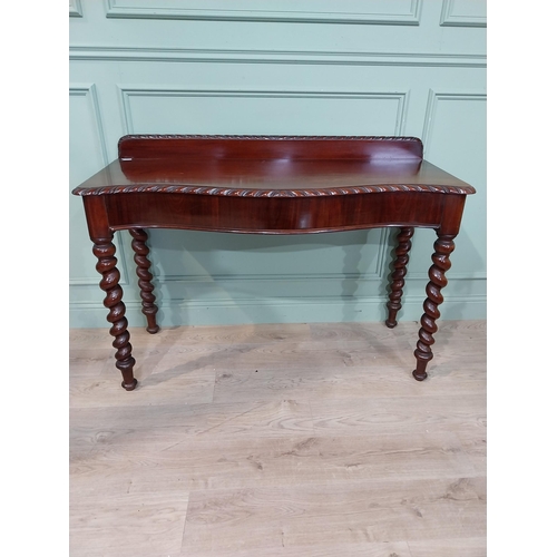 86 - Good quality 19th C. mahogany serpentine fronted console table on barley twist legs with gallery bac... 