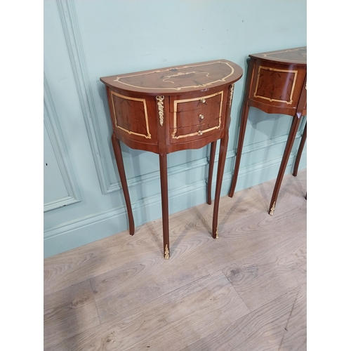 162 - Pair of French kingwood and ormolu mounted bedside lockers on cabriole legs. {70 cm H x 45 cm W x 25... 