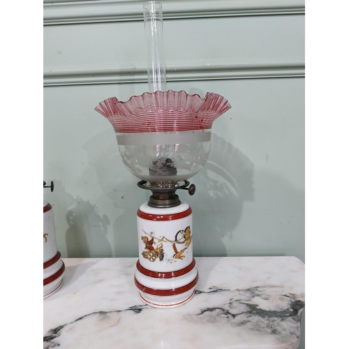 264 - Pair of 19th C. ceramic oil lamps decorated with Roman scenes  - one with original ruby glass shade.... 