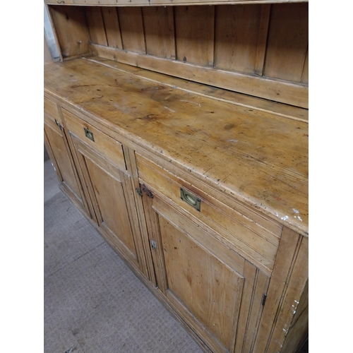 31 - Early 20th C. scrubbed pine Country House kitchen dresser with three drawers above three blind doors... 