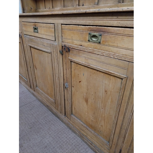 31 - Early 20th C. scrubbed pine Country House kitchen dresser with three drawers above three blind doors... 