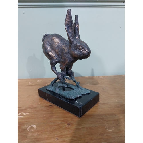 312 - Good quality bronzed cast iron sculpture of a Jumping Hare on marble base. {23 cm H x 17 cm W x 10 c... 