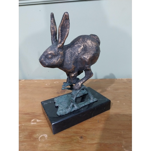 312 - Good quality bronzed cast iron sculpture of a Jumping Hare on marble base. {23 cm H x 17 cm W x 10 c... 