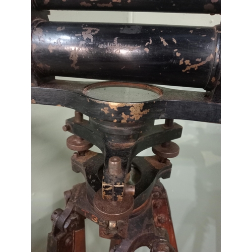 20 - 1900's brass Surveyor's theodolite mounted on an adjustable wooden tripod base. {168 cm H x 20 cm W ... 