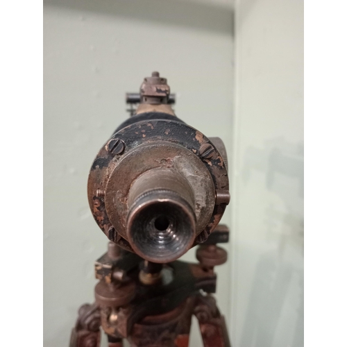 20 - 1900's brass Surveyor's theodolite mounted on an adjustable wooden tripod base. {168 cm H x 20 cm W ... 