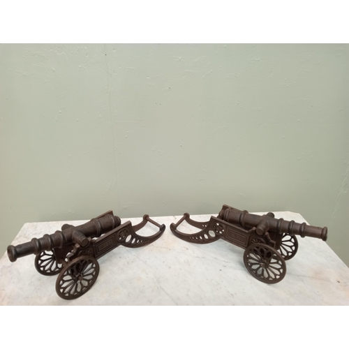 218 - Pair of cast iron table cannons. {H 16cm x W 50cm x D 13cm }.  NOT AVAILABLE TO VIEW IN PERSON.