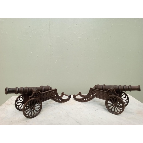 218 - Pair of cast iron table cannons. {H 16cm x W 50cm x D 13cm }.  NOT AVAILABLE TO VIEW IN PERSON.