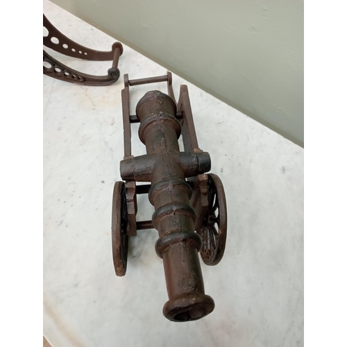 218 - Pair of cast iron table cannons. {H 16cm x W 50cm x D 13cm }.  NOT AVAILABLE TO VIEW IN PERSON.