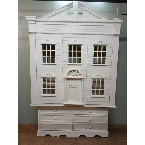 260 - Painted wooden wardrobe in the form of a Doll's House with three doors over three short drawers. {H ... 