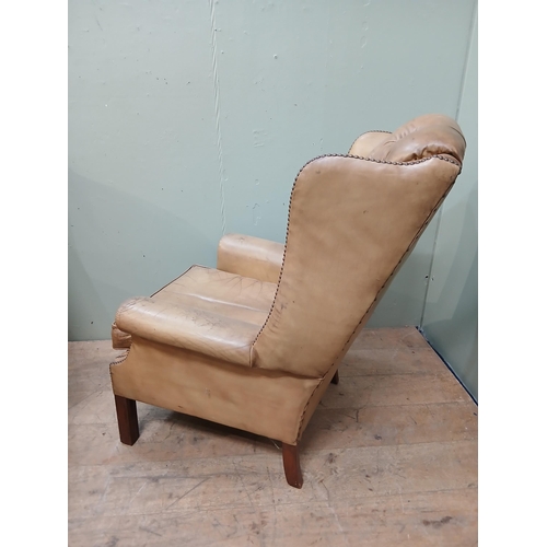 262 - Pair of deep buttoned leather upholstered wingback armchairs with studded detail.  {H 105cm x W 75cm... 