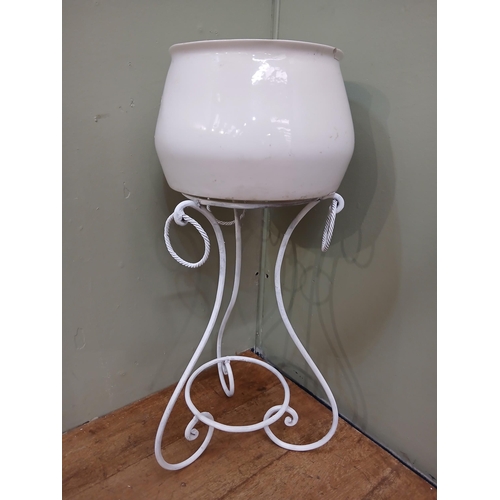 337 - Wrought iron scrolled plant stand with ceramic plant pot. {H 90cm x Dia 45cm }.  NOT AVAILABLE TO VI... 