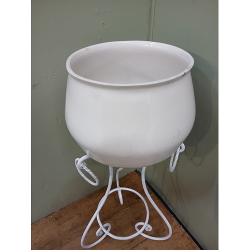 337 - Wrought iron scrolled plant stand with ceramic plant pot. {H 90cm x Dia 45cm }.  NOT AVAILABLE TO VI... 