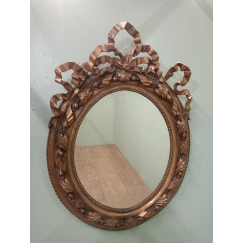 360 - Giltwood Rococo style oval wall mirror.  {H 115cm x W 84cm }.  NOT AVAILABLE TO VIEW IN PERSON.