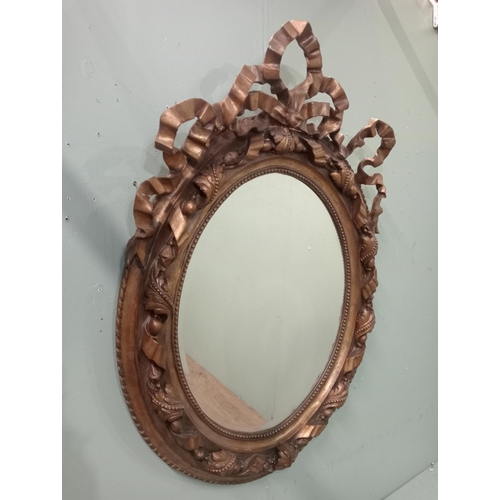 360 - Giltwood Rococo style oval wall mirror.  {H 115cm x W 84cm }.  NOT AVAILABLE TO VIEW IN PERSON.