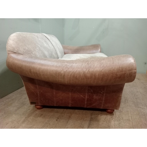 365 - Halo design two seater sofa with suede and leather upholstery on turned feet.  {H 80cm x W 195cm x D... 