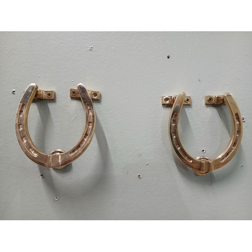 393 - Pair of solid brass door knockers in the form of Horse Shoes.  {H 11cm x w 10cm x D 3cm }.  NOT AVAI... 