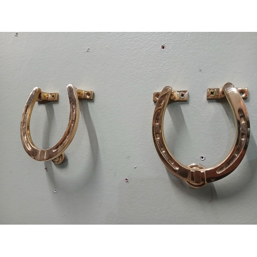 393 - Pair of solid brass door knockers in the form of Horse Shoes.  {H 11cm x w 10cm x D 3cm }.  NOT AVAI... 
