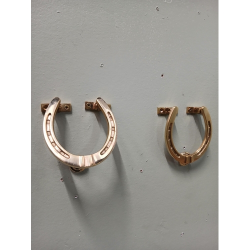 393 - Pair of solid brass door knockers in the form of Horse Shoes.  {H 11cm x w 10cm x D 3cm }.  NOT AVAI... 