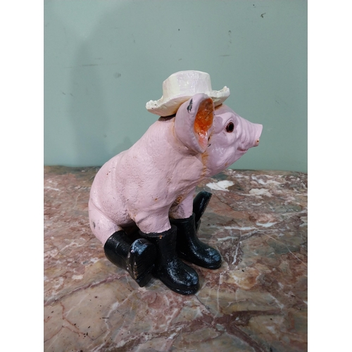 33 - Cast iron model of a Pig. {22 cm H x 25 cm W x 16 cm D}.