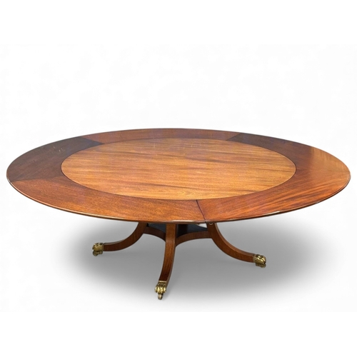 406 - A large quality Georgian style mahogany circular Jupe table table with pedestal base and large brass... 