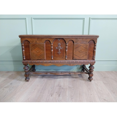 1019 - Edwardian walnut blanket box raised on turned legs and single stretcher in the Tudor style {76 cm H ... 