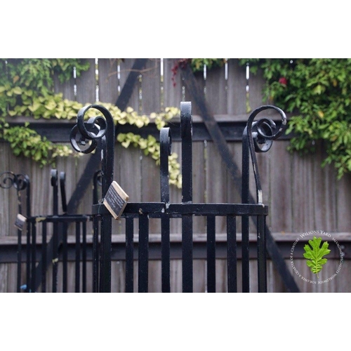 13 - Pair of wrought iron tree protectors with cast iron square base. {185 cm H x 120 cm W x 120 cm D}.