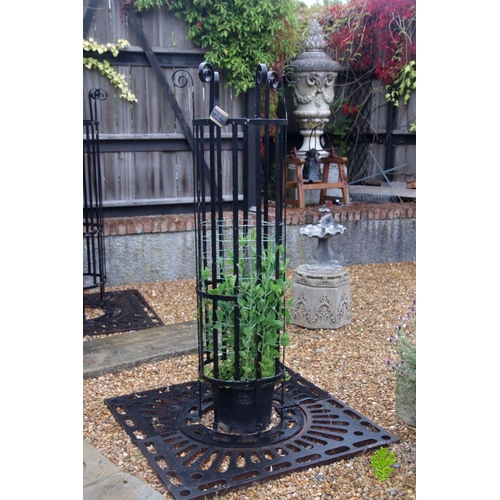 13A - Pair of wrought iron tree protectors with cast iron square base. {185 cm H x 120 cm W x 120 cm D}.