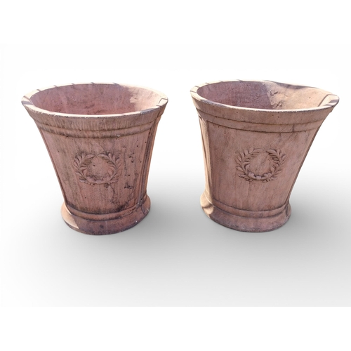 15 - Pair of moulded terracotta planters decorated with wreaths. {51 cm H x 52  cm Dia.}.