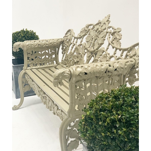 37 - Cast iron two seater garden bench with arms terminating in Dog's head with oak and ivy decoration in... 