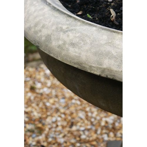 46 - Pair of period style cast iron urns sitting on a small square stone plinth. (Plants not included). {... 