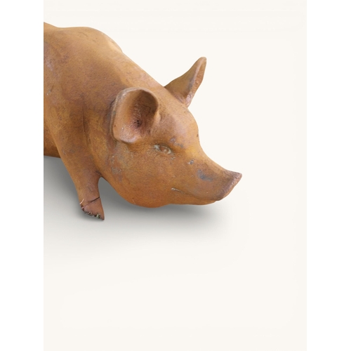 53 - Large cast iron model of Pig. {30 cm H x 68 cm W x 25 cm D}.