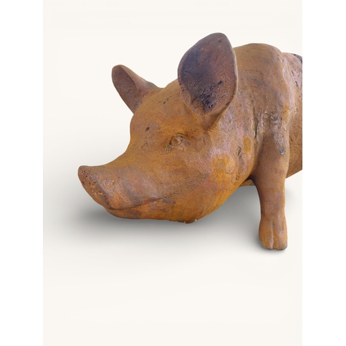 53 - Large cast iron model of Pig. {30 cm H x 68 cm W x 25 cm D}.