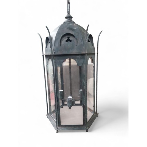18 - Good quality bronzed metal Gothic hanging lantern. {80 cm H x 40 cm Dia. with chain drop of 100 cm }... 