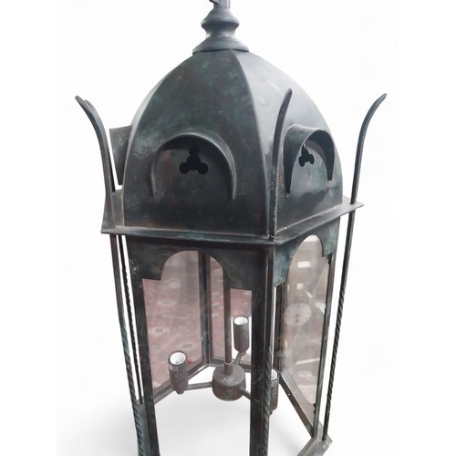 18 - Good quality bronzed metal Gothic hanging lantern. {80 cm H x 40 cm Dia. with chain drop of 100 cm }... 