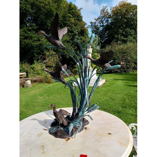 27 - Good quality bronze sculpture of Ducks flying in Bullrushes. { 90cm H X 70cm W X 62cm D }.