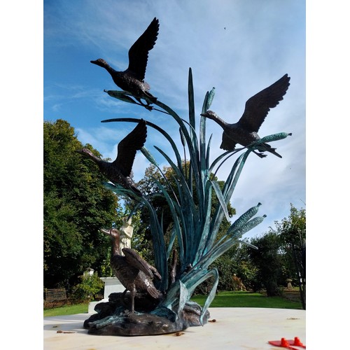 27 - Good quality bronze sculpture of Ducks flying in Bullrushes. { 90cm H X 70cm W X 62cm D }.