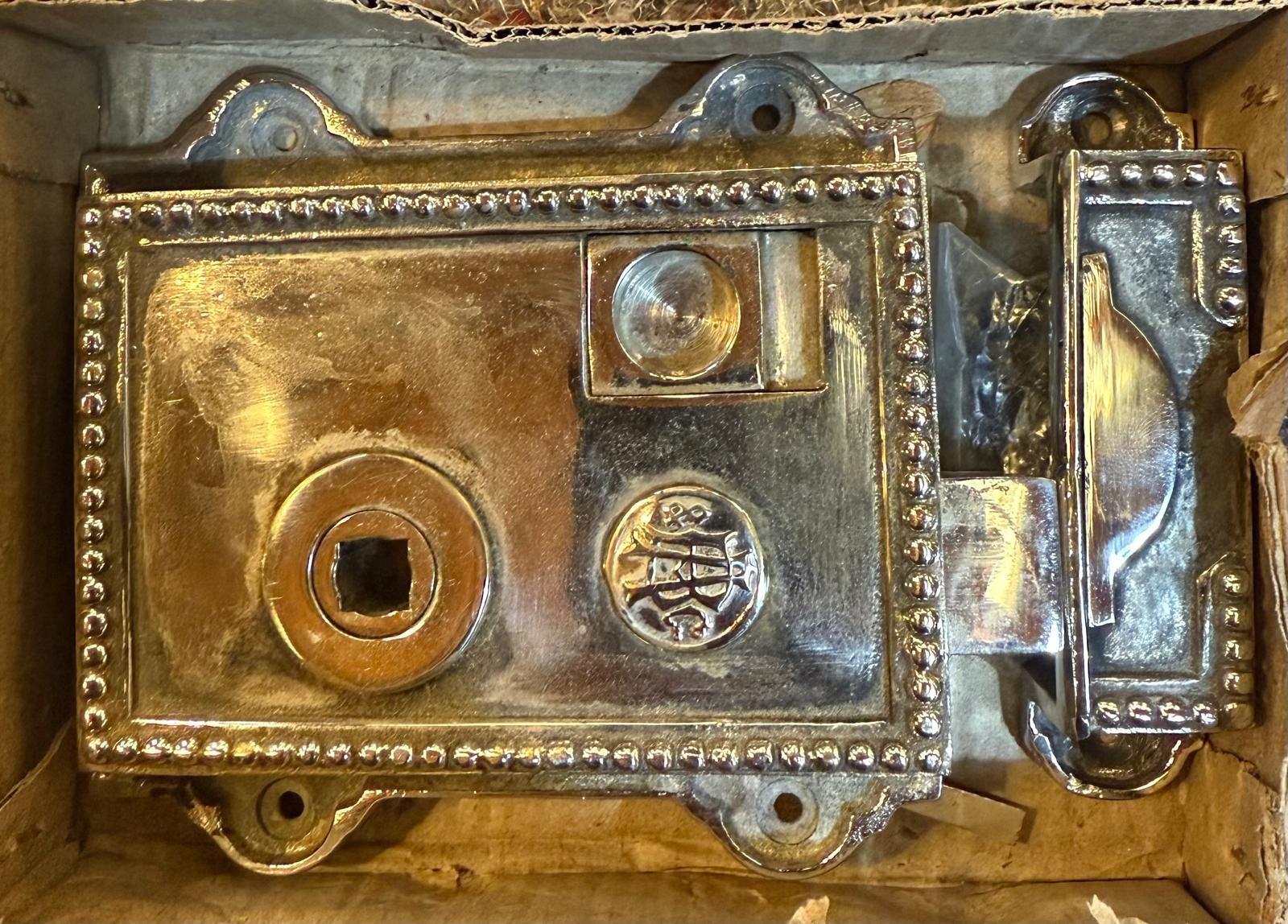 Cast brass Rim Latch. {10.8 cm H x 11.4 cm W x 2.5 cm D}.