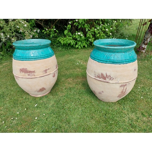 30A - Pair of good quality glazed terracotta urns. {69 cm H x 51 cm Dia.}.